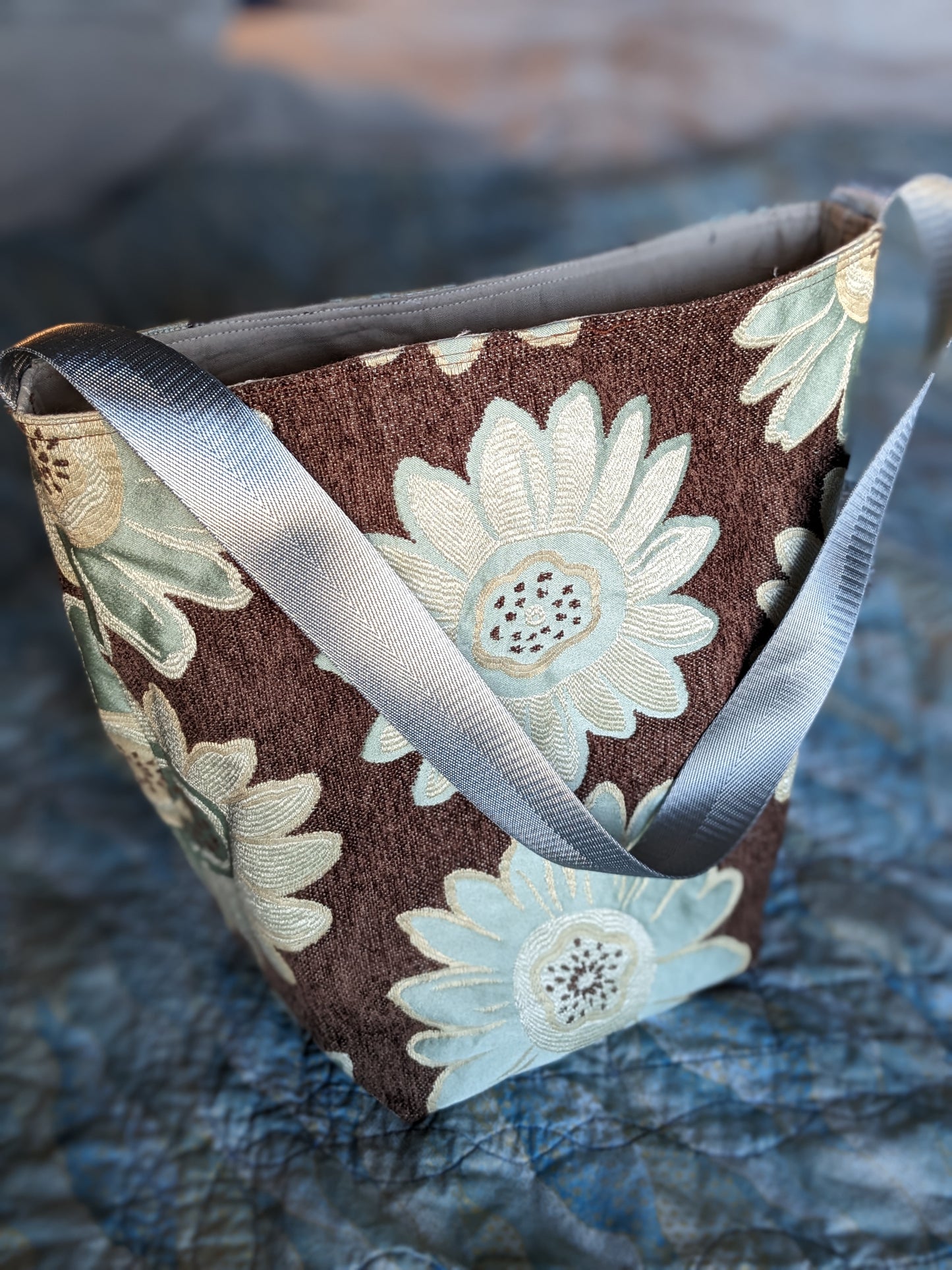 Bigger blooms on this slightly smaller bag.  Fully lined with an interior pocket.   13 x 8 x 7 inches with a 28.5 inch silver/grey strap.  One of a kind, like you!